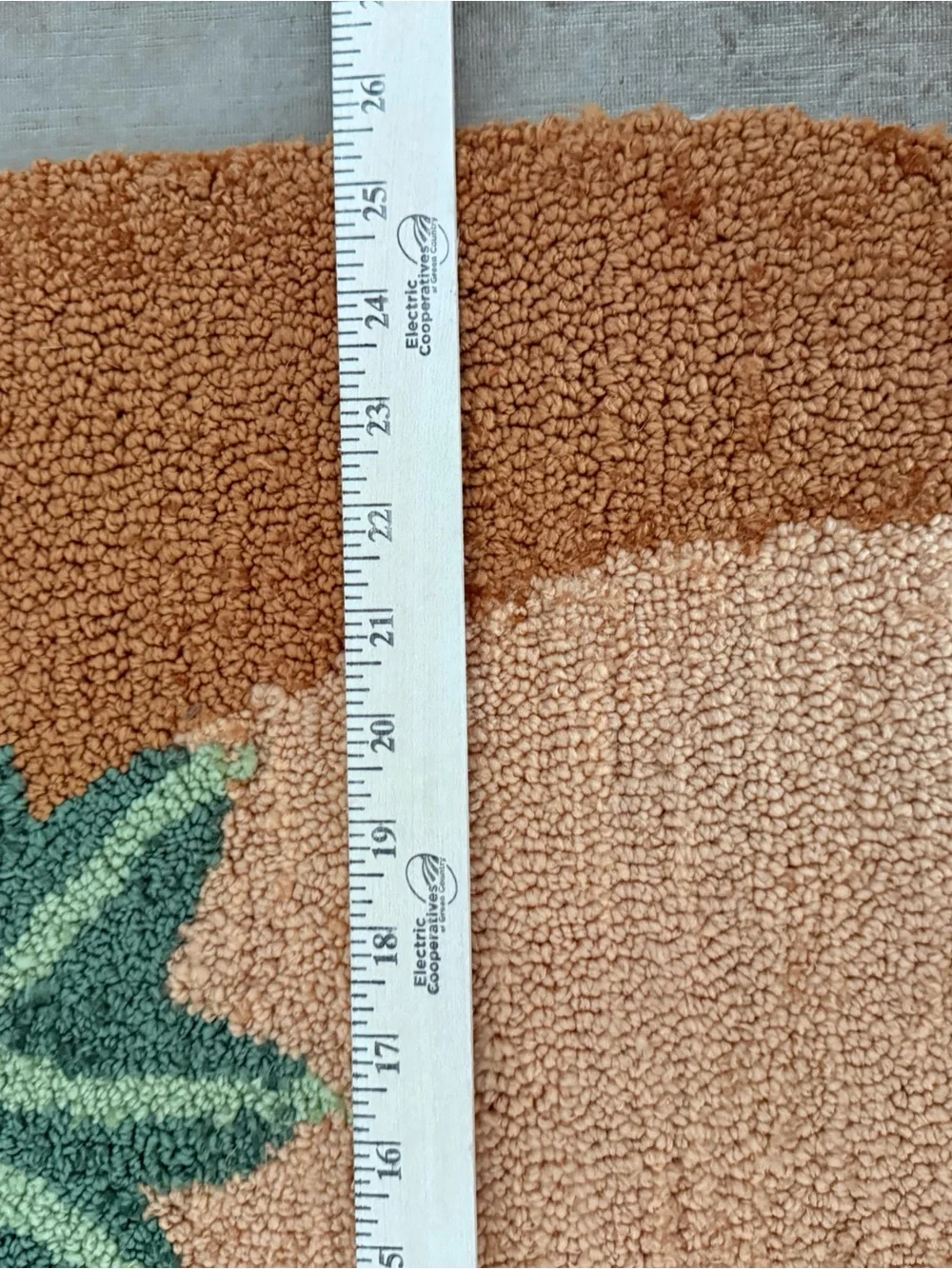 Autumn Pumpkin Accent thick and plush hooked Rug , and an orange cloth pumpkin.